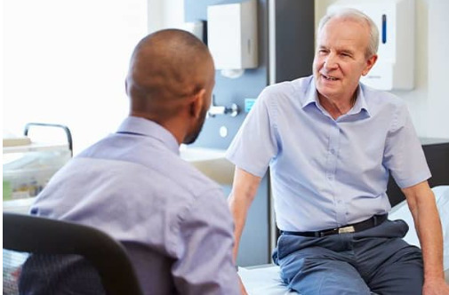 Doctor speaks to patient about reasons to have an endoscopy