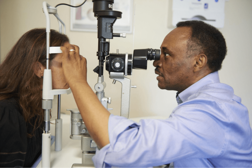 Patient getting eyes tested to help decide on cataract lens type