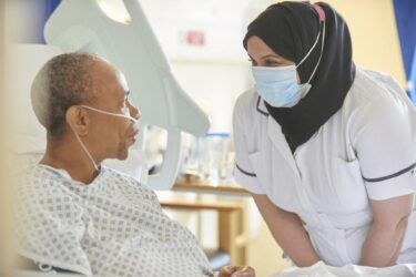 a nurse speaking to a patient
