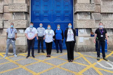 HMP Exeter staff stand outside the prison entrance