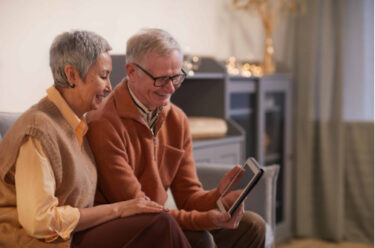 Elderly couple use a tablet