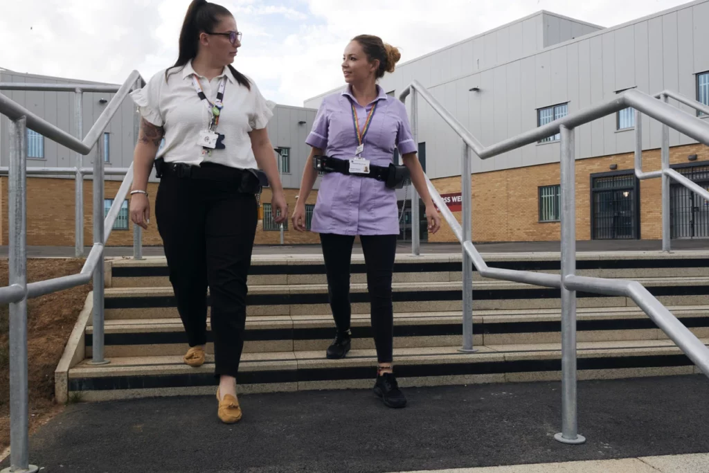 Nurses walking outside prison