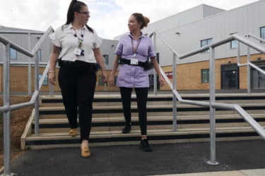 Nurses walking outside prison