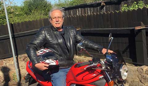 Geoffrey Oldknow on his motorbike after hip replacement surgery in Barlborough