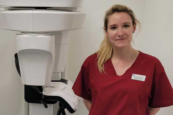 Practice Plus Group staff standing next to x-ray equipment at Emersons Green