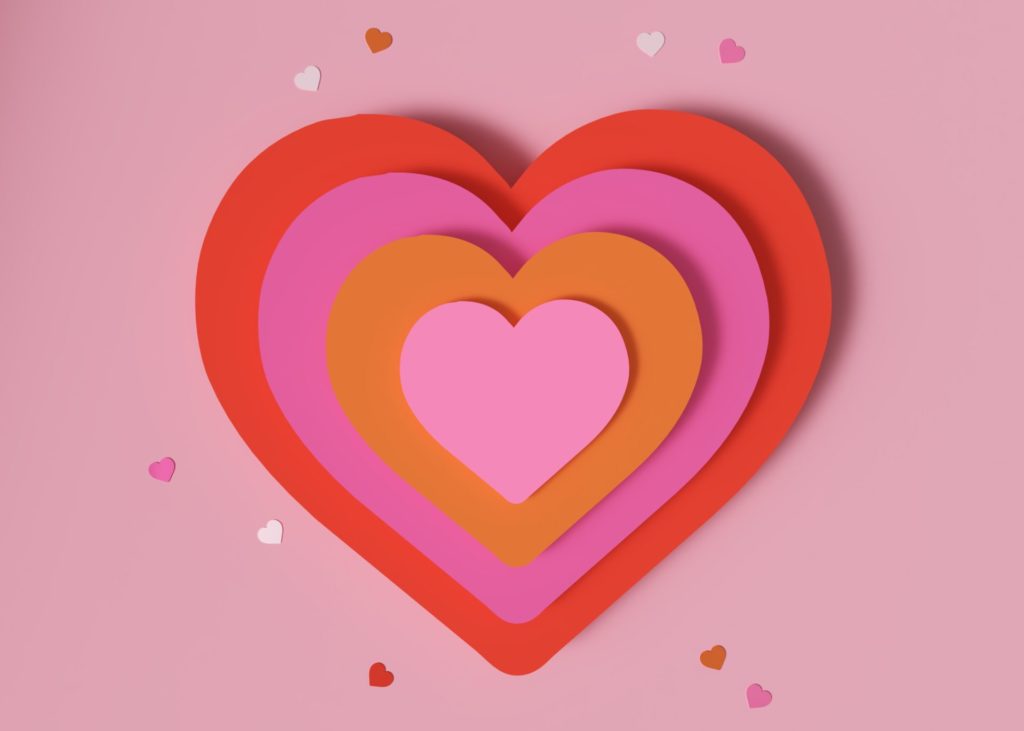 Cut out paper hearts to demonstrate heart health