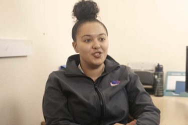 One of our colleagues smiling and chatting about jobs in Health in Justice