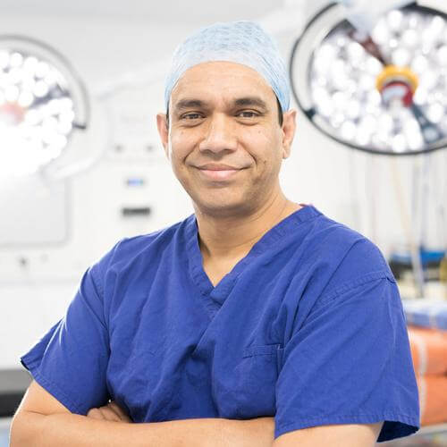 Nurul consultant orthopaedic surgeon smiling in theatre