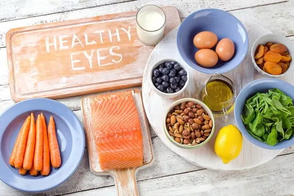 A platter of food for good eye health, including salmon, eggs, nuts and fruits and vegetables