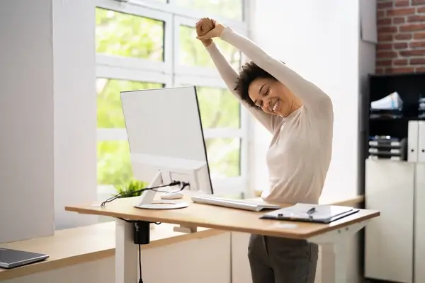 Woman stretches to relieve carpal tunnel pain 