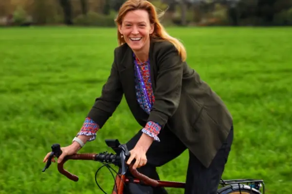 Susanna on her bike in a field