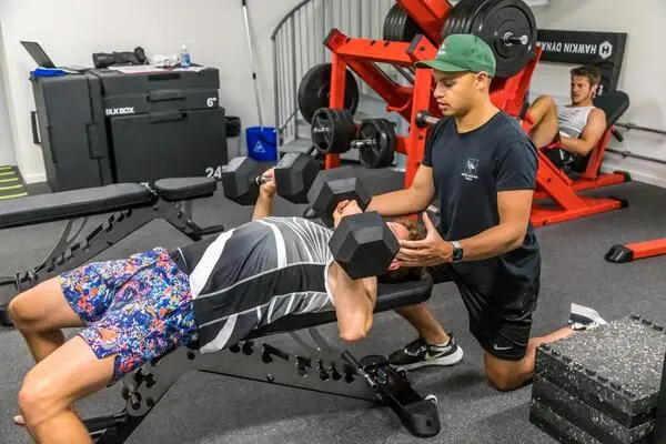 Physio James training the Olympic rowing team at the gym