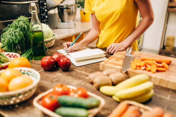 woman in kitchen with healthy food