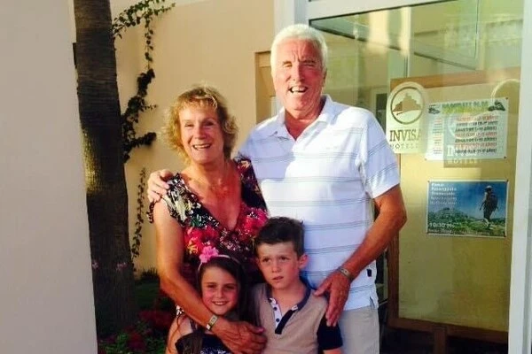 Sue with her husband and grandchildren 