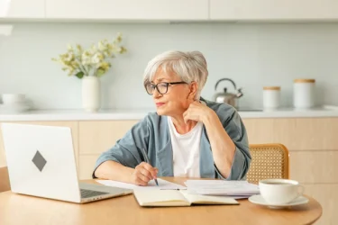 hip surgery barlborough older woman looking at laptop